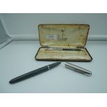 A boxed Parker 51 fountain pen and pencil Mk1 set, circa 1958, Navy Grey with lustraloy caps, fine