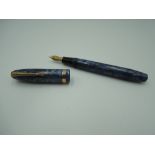 A Conway Stewart 84 fountain pen, circa 1957, blue and gold veins, broad nib, lever fill,