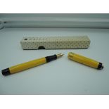 A boxed Parker Lady Duofold fountain pen, Mandarin Yellow ringtop, medium nib, button fill, good