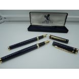 A boxed pair of fountain pen in the Ritz Hotel London livery, fine nibs, cartridge. A rare set