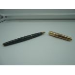 A Parker 65 fountain pen, Grey with Rolled Gold cap, medium nib, aeromatic, fine condition, made