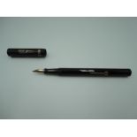 A Berkeley fountain pen, The Berkeley Pen, in Black Hard Chased Rubber with medium nib, a lever fill