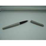 A Parker 45 fountain pen, Stainless steel patterned, medium nib, aeromatic, as new, made in the UK