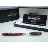 A modern boxed Conklin fountain pen, red desert, crescent fill, made in the USA