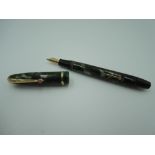 A Conway Stewart Dinkie 550 fountain pen, circa 1955, in green and brown marble, fine nib, lever