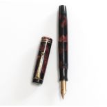 A Parker fountain pen. A Parker Streamlined Duofold, button fill circa 1930, two narrow bands to the