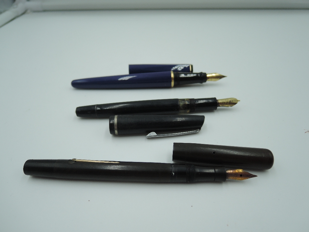 Three Fountain pens. A Mabie Todd Swan self filler, a Waterman France, and an Osmiroid