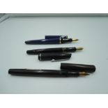 Three Fountain pens. A Mabie Todd Swan self filler, a Waterman France, and an Osmiroid