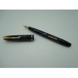 A boxed Conway Stewart 12 fountain pen, circa 1956, in blue brown marble, medium nib, lever fill,