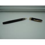 A Sheaffer fountain pen, Black with gold trim, fine./medium nib, touchdown, made in the USA