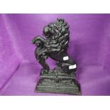 A cast iron door stop in the form of a Lion