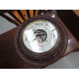 An early 20th Century mahogany cased aneroid barometer