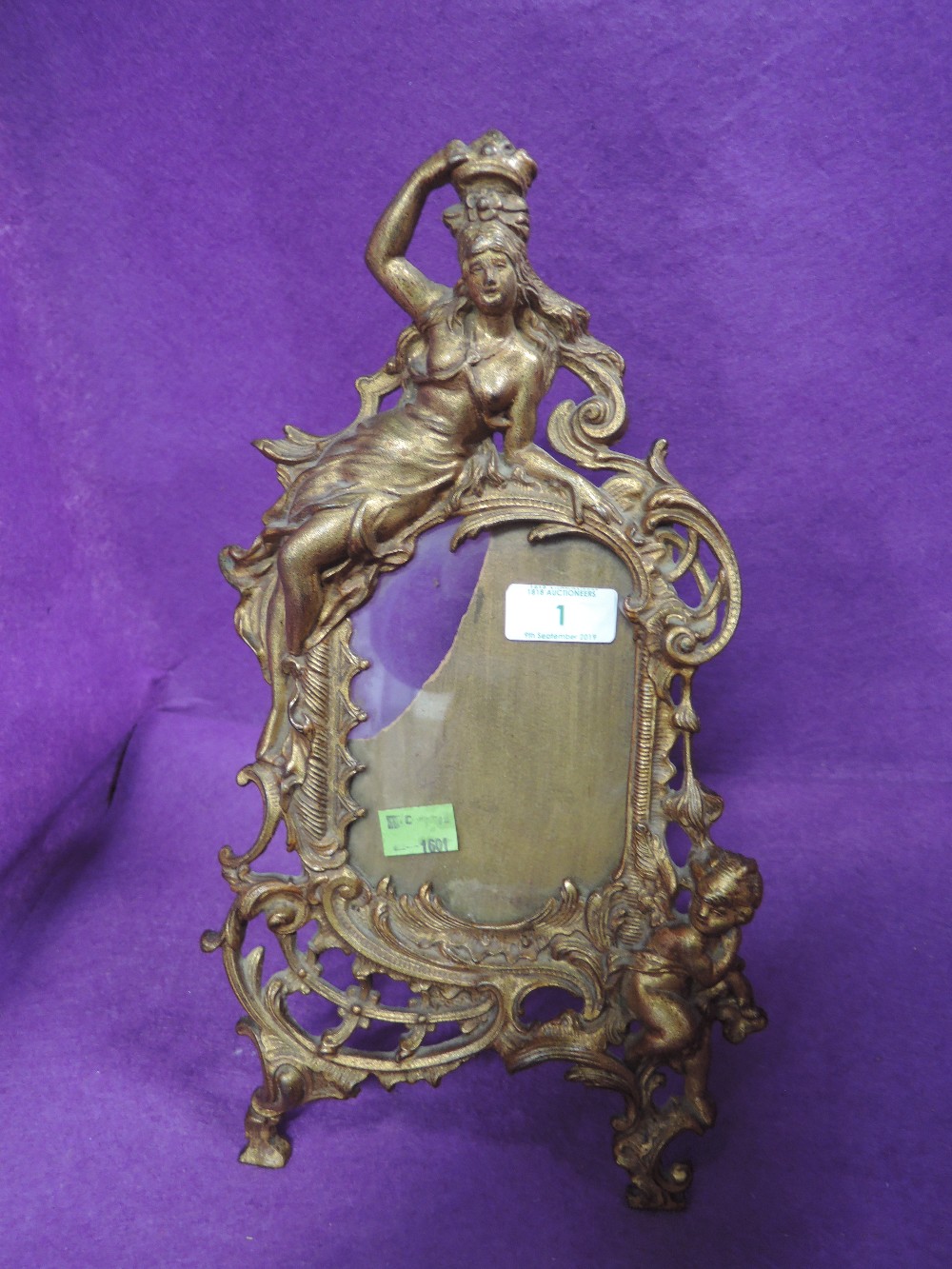 A metal cast Victorian photo frame with cherub and Britannia