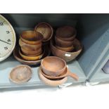 A selection of wooden treen bowls and scoop