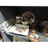 A selection of decorative plaques and ceramics