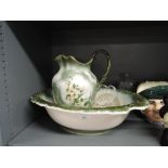 A large wash jug and bowl set with floral print