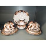 A part tea service by Royal Albert with gilt and hand decorated