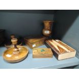 A selection of treen carved wood items including candle sticks