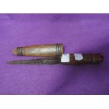 A small antique wooden handled knife and scabbard