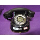 A vintage metal bodied and transfer printed telephone by Bell