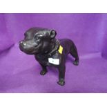 A heavy brass cast bronze effect figure of a Staffordshire terrier dog