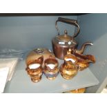 A large copper stove kettle and similar