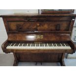 A 19th Century walnut cased upright piano, labelled for Riley & Sons, Birmingham
