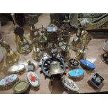 A selection of brass bells and pill boxes
