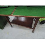 A vintage fold over tea/games trolley with green baize top