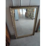 A large modern gilt framed mirror