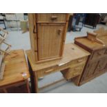 A bamboo dressing table and bedside cabinet
