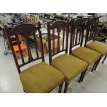 A set of four Art Nouveau mahogany dining chairs