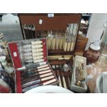 A selection of flatware and boxed cutlery