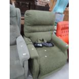 An electric recliner chair in dark green