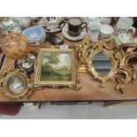 A selection of gilt and plaster frames and mirrors