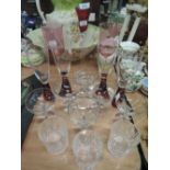 A selection of Babycham glasses and ruby stemmed wine glasses