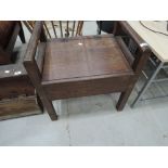 A vintage oak piano stool
