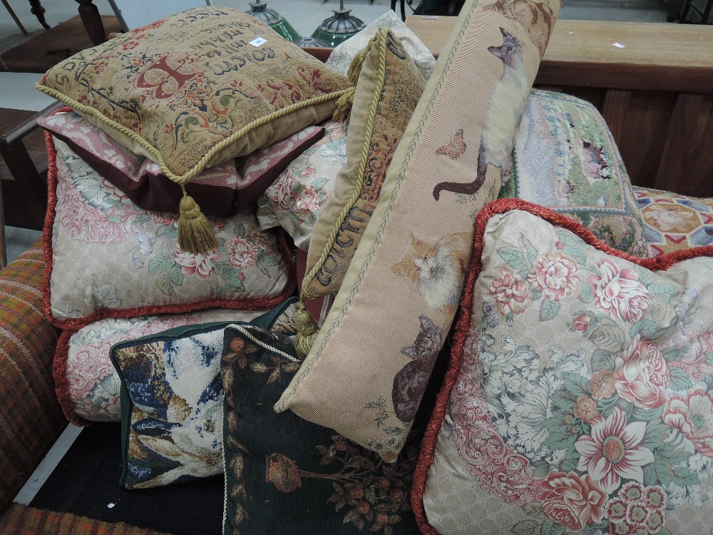 A large selection of scatter cushions including woolwork