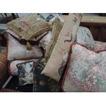 A large selection of scatter cushions including woolwork