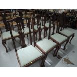 A set of four early 20th Century stripped dining chairs