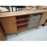 A vintage teak or sapele bookcase