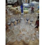 A large selection of decanters and other decorative glass ware included silver mounted scent bottle