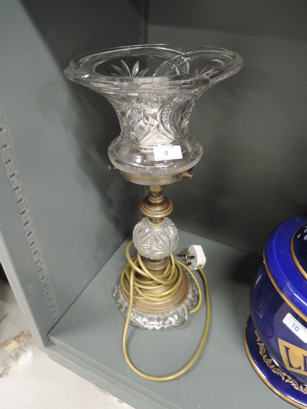 An early crystal glass and brass based lamp