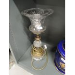 An early crystal glass and brass based lamp