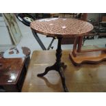 A traditional mahogany frame copper top occasional pedestal table
