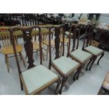 A set of four early 20th Century stripped dining chairs