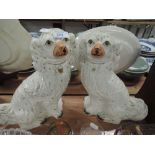 A pair of Victorian style Staffordshire fireside dogs