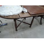 A reproduction oak oval dining table