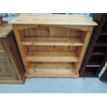 A set of modern pine medium height bookshelves