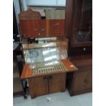 A vintage mid century walnut Cocktail cabinet